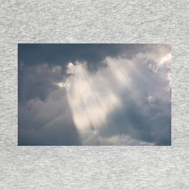 Vivid sunbeam light ray from clouds by Juhku